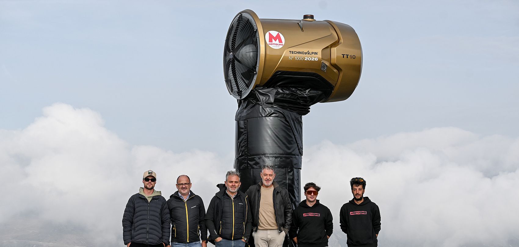 Golden TT10 with five representatives from TechnoAlpin and Mottolino in the foreground.