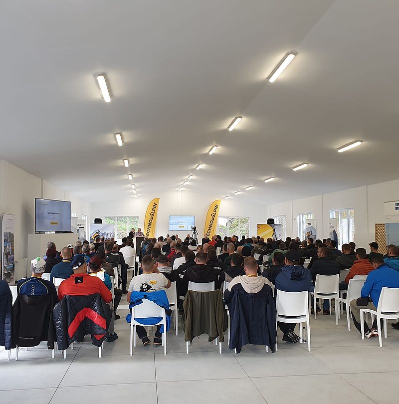 Large indoor conference hall packed with attendees at TechnoAlpin Snowmaster Days Romania event