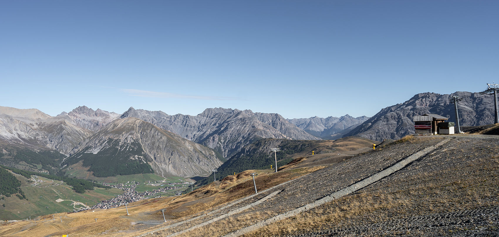 Construction site at Mottolino with several TT10 tower snow guns already installed.