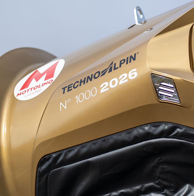 Close-up of the golden TT10’s turbine featuring the Mottolino logo.