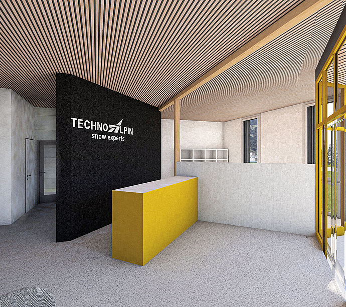 Reception area with TechnoAlpin logo on black wall, yellow reception desk and slatted wood ceiling.