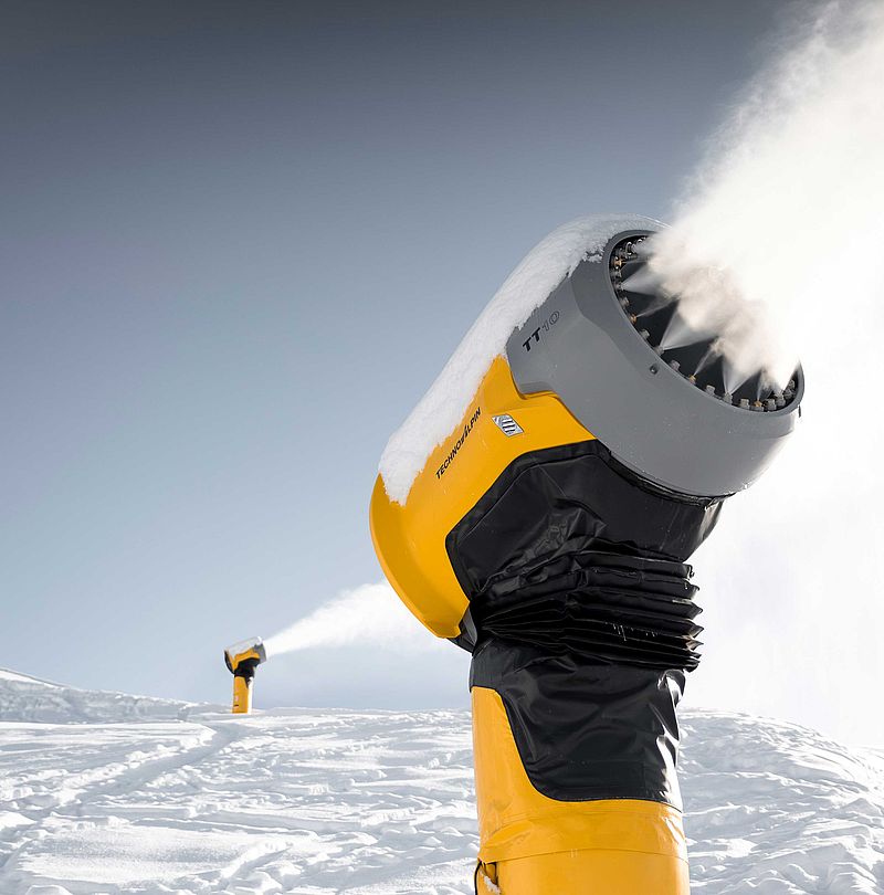Yellow fan gun TT10 Buffaure in action on snowy ski slope